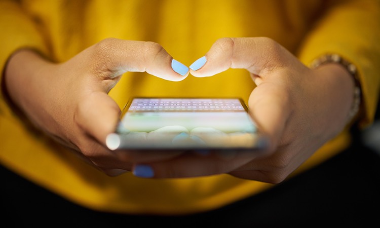 close up of a person texting on their smartphone