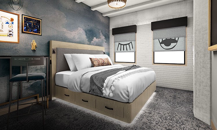 guest room with a white linen bed, desk area, and artwork on walls