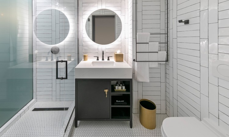 King room bathroom with white tile detailing