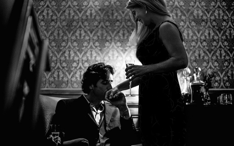 Man kissing woman's hand