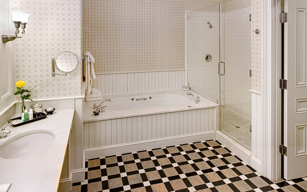 Full bathroom with vanity, sink, tub & glass shower