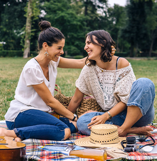 two women having a picnic together