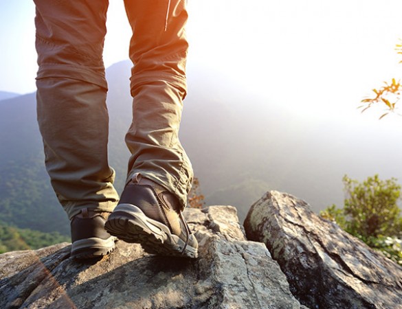 a shot of a person's feet hiking
