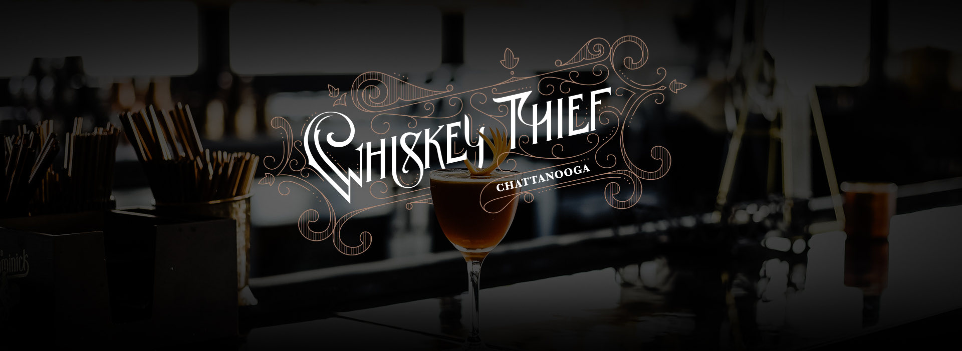 whiskey thief logo with dark image of a bar counter and a cocktail