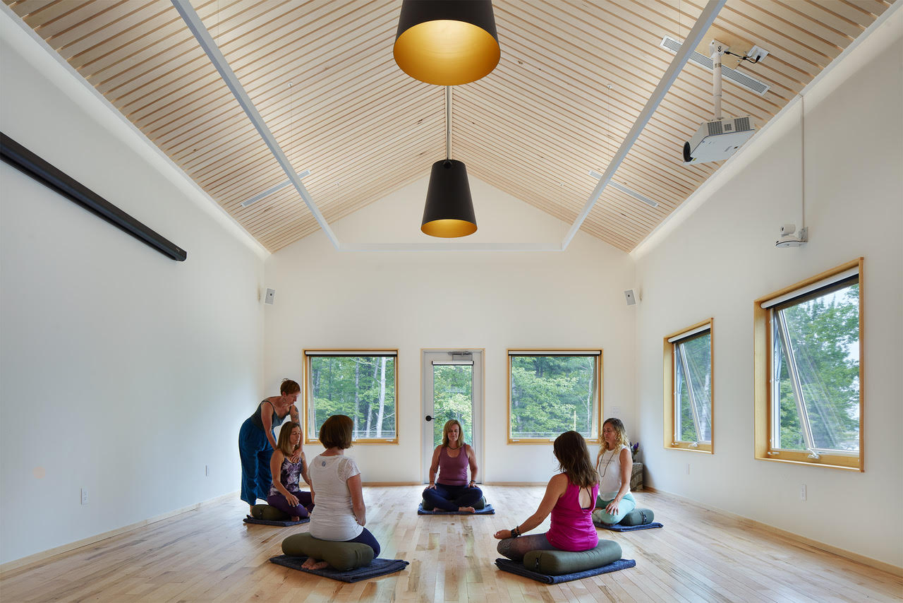 women having their indoor meditation class