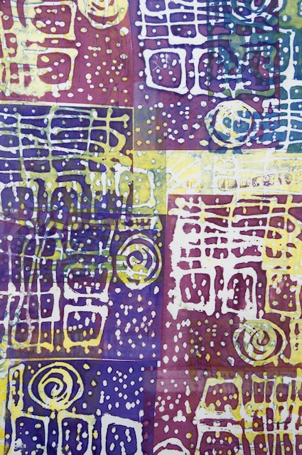 Front view of an abstract purple and yellow painting