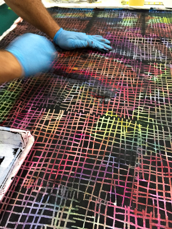View of a person painting some colorful messy lines