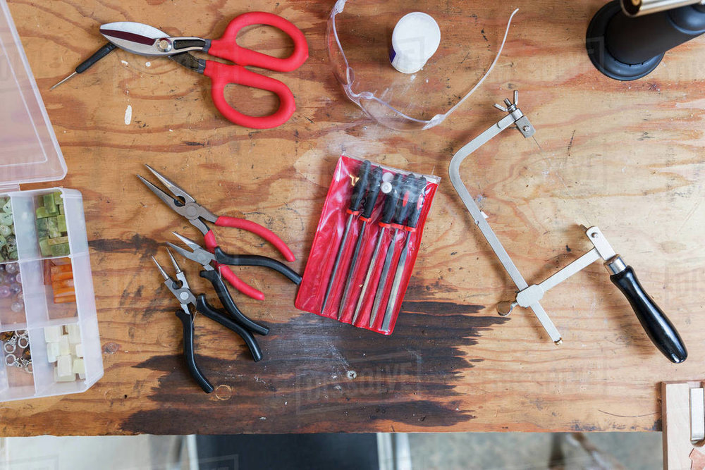 tools of jewelry studio as scissors and pliers