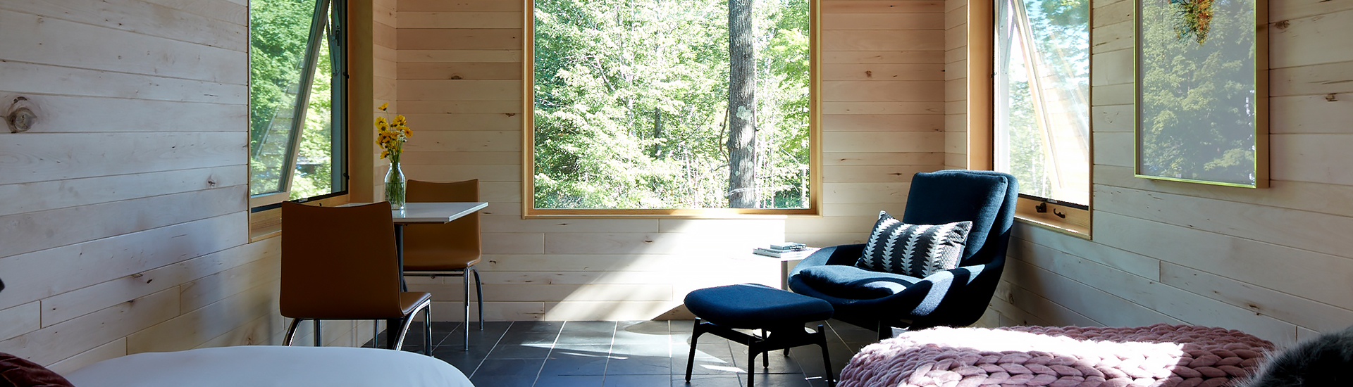 Internal view of a room with some windows and a lovely nature view