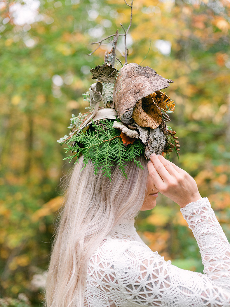 a hat shape with variations of leaves and branches on a ladys head