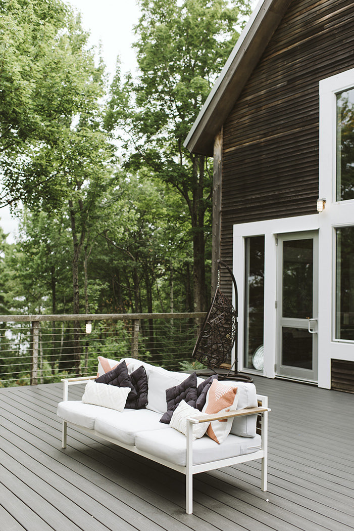 view of a balcony of a tree house with features as a white couch 