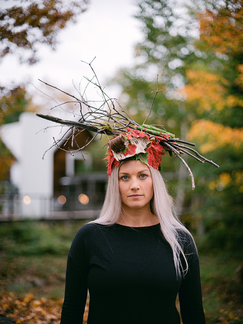 a hat shape with variations of leaves and branches on a ladys head