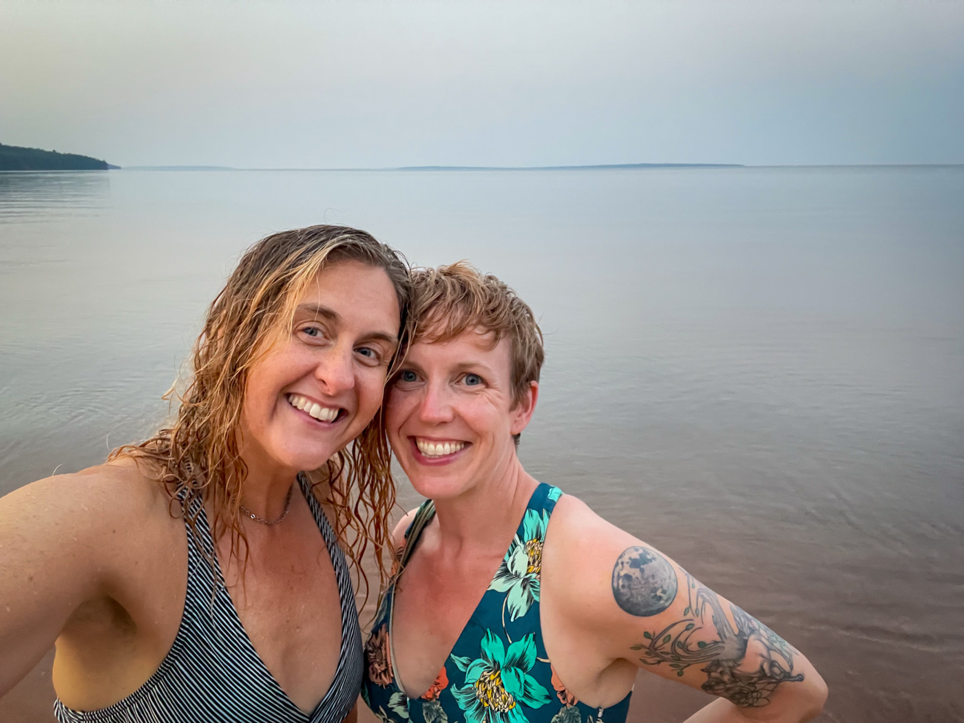 two women taking a selfie in the water