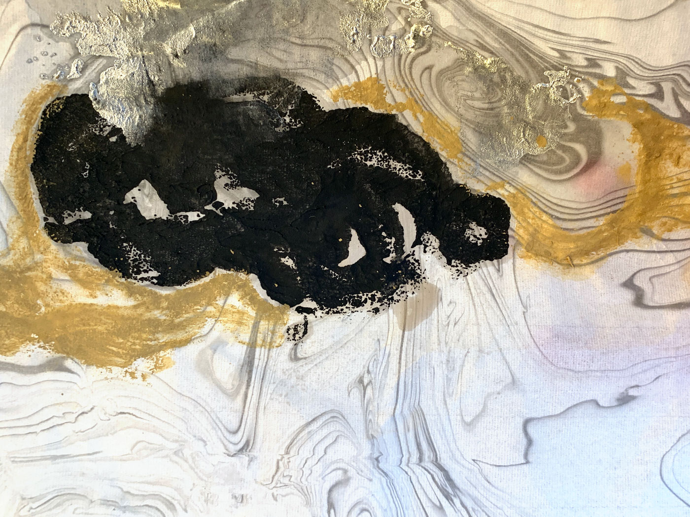 View of an abstract painting with black, gray, yellow and white colors