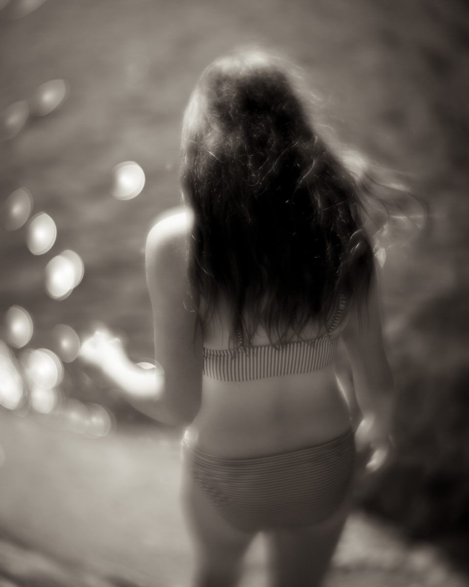 blurry image of a lady wearing swimsuit 