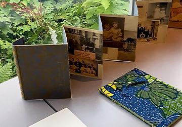 Top view of some notebooks and a family album