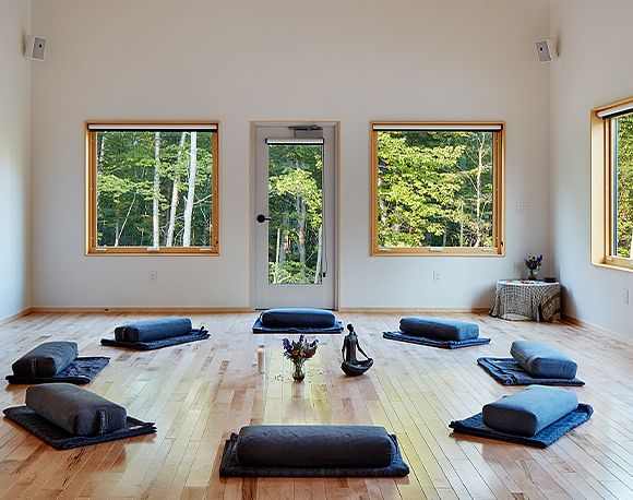 Internal view of the Peace Pod Facility full of yoga mat