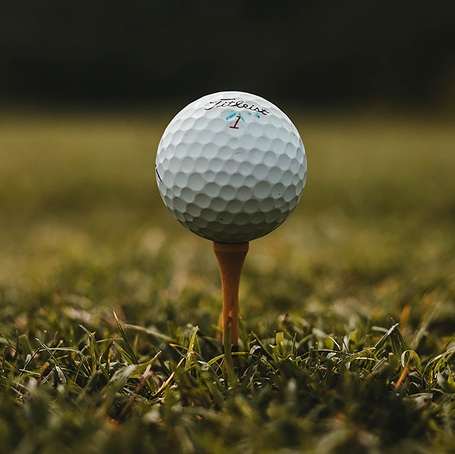 golf ball on top of a tee