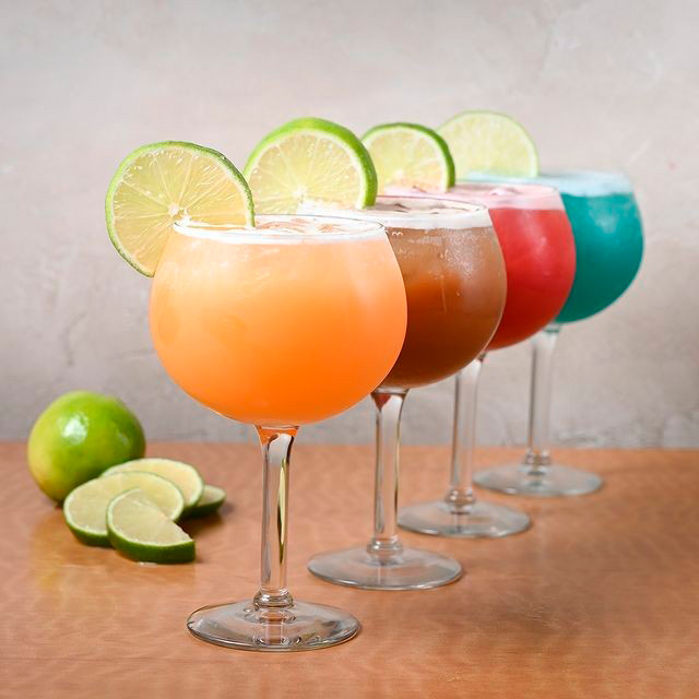 Closeup view of four tropical cocktails