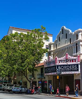 View of a movie theatre facade on a crowded street
