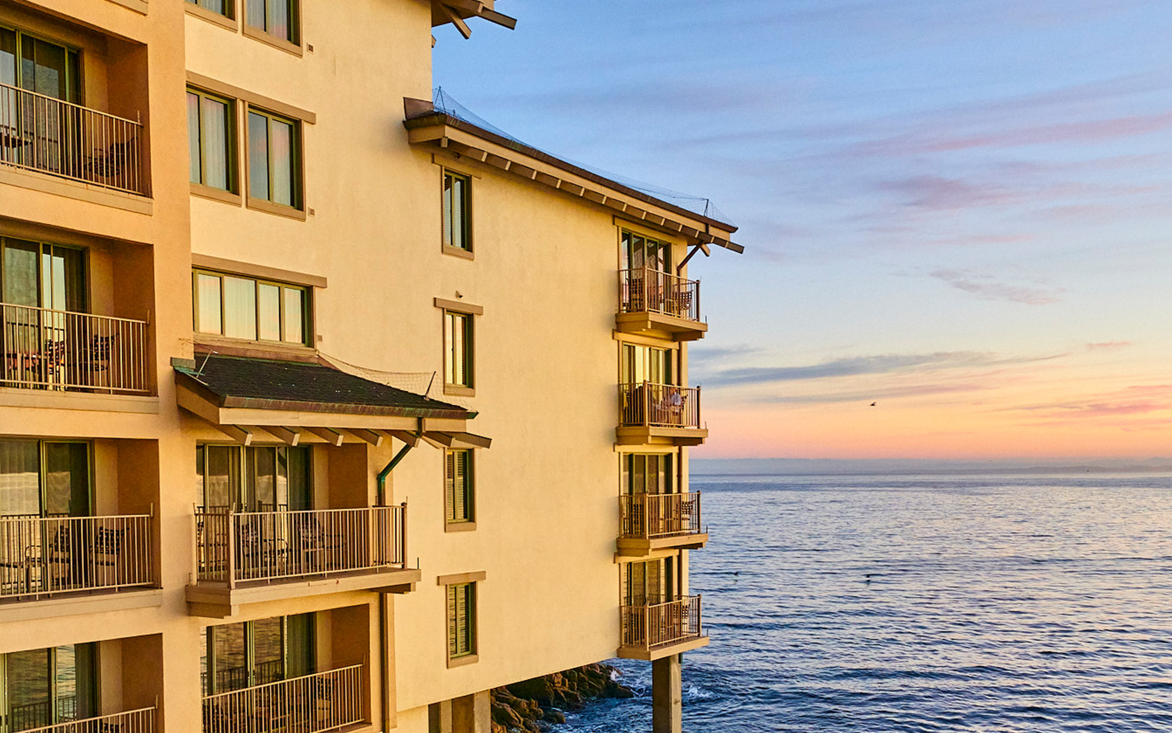 Sideview of the Monterey plaza property at sunset