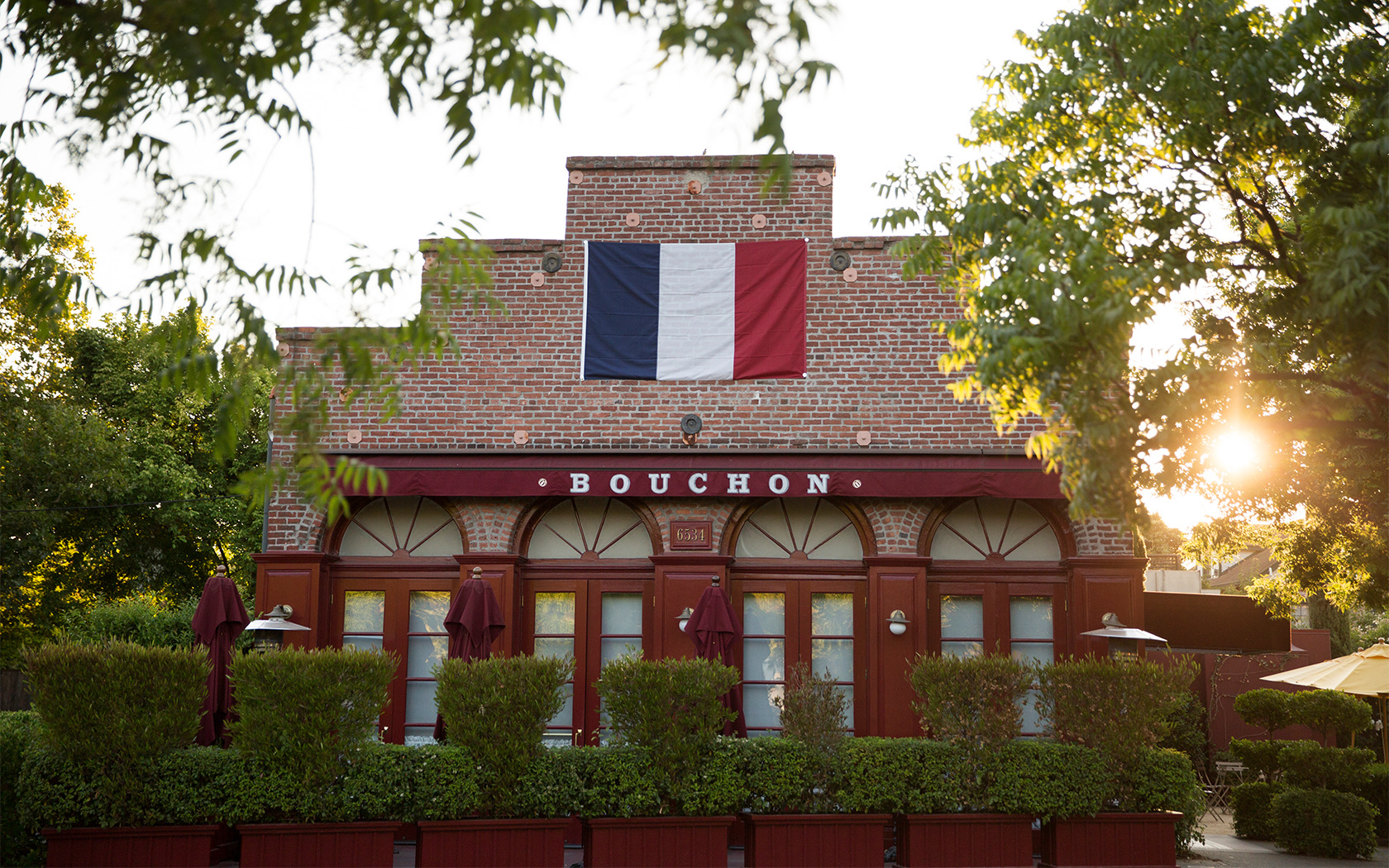 View of the Bouchon facade with a french flag 