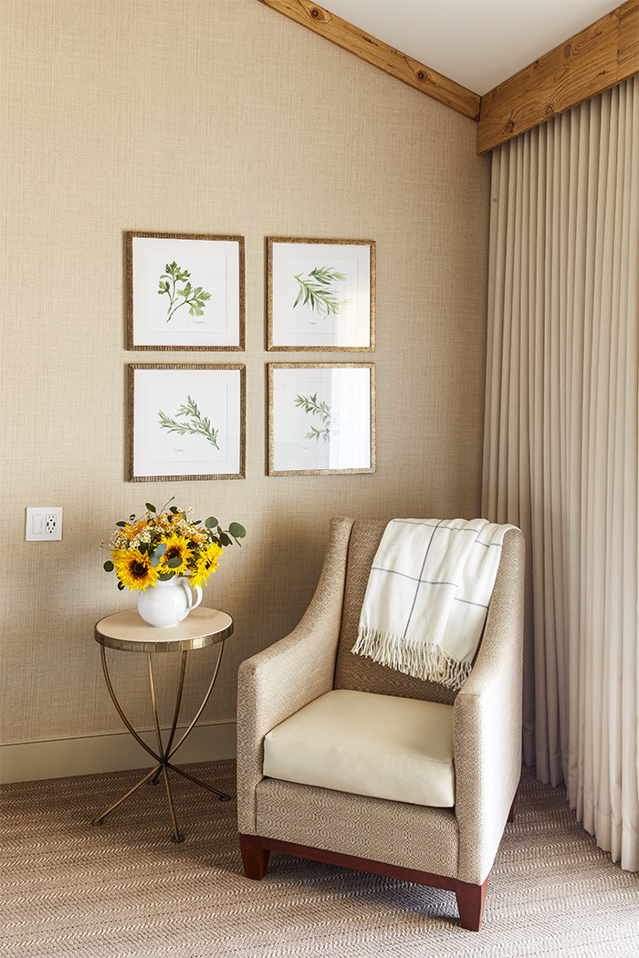 Corner view of a chair and a table with beautiful sunflowers 