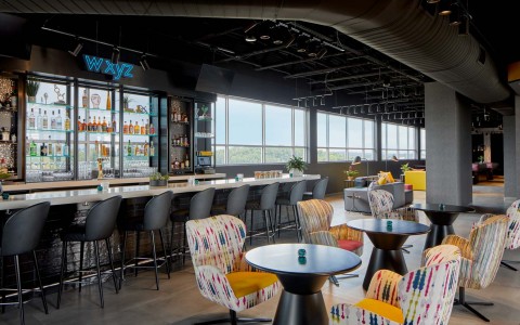 side angle of the bar and its modern, yet colorful decor