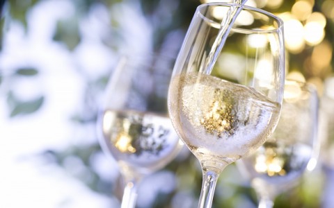 wine glasses being filled outdoors
