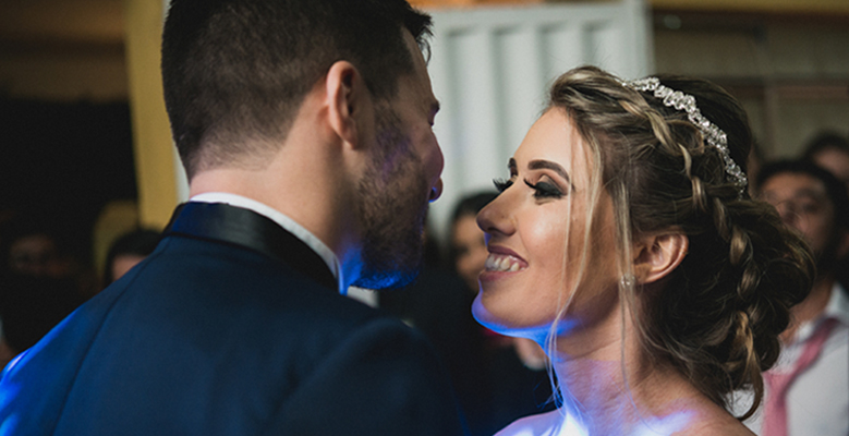 a bride and groom sharing their first dance together