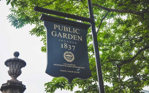 close look at an old sign for the Public Garden