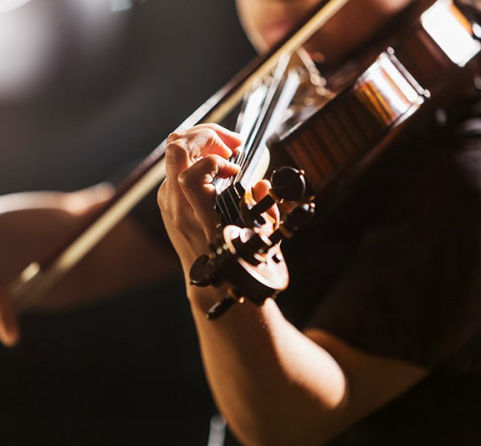 close up of a violinist playing a violin 
