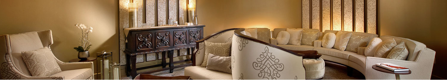 lounge area with curved seating spaces and warm soft lighting