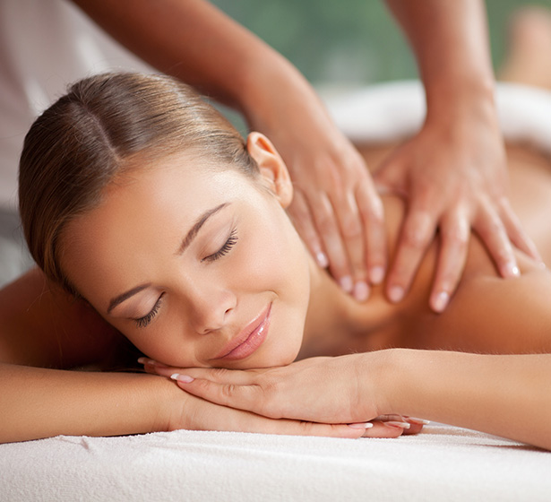 woman getting a massage at a spa