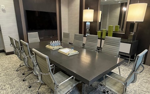 conference room with a table and office chairs