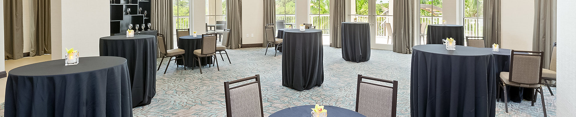 event space with small tall round tables