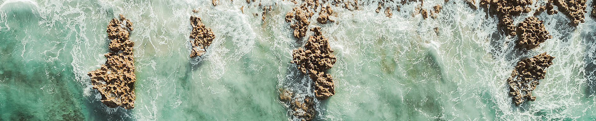 aerial view of ocean and rocks