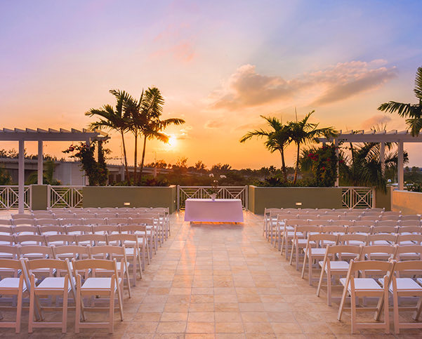 tables set for an outside sunset wedding