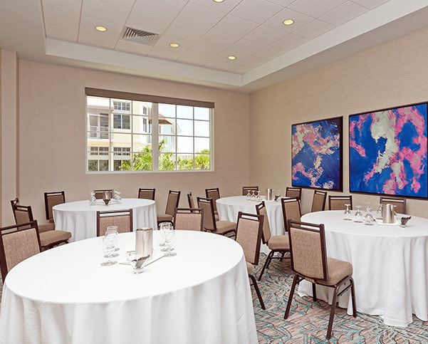 event space with round tables and rectangular tables