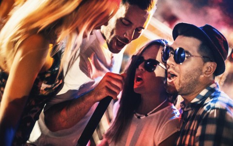 friends singing karaoke