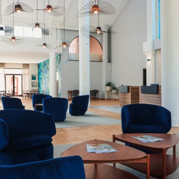 lobby area with blue swivel chairs