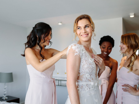 Bride and Bridesmaids laughing together