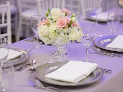 Detail shot of white and pink flower arrangement on a table