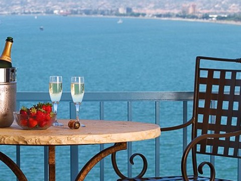 Balcony table and chairs off our rooms with view of San Diego Bay