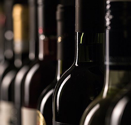 Wine bottles lined up in a row