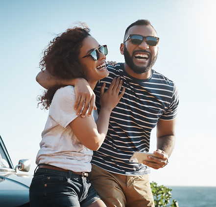 a couple laughing on a sunny day