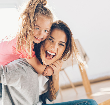 Mother and daughter laughing
