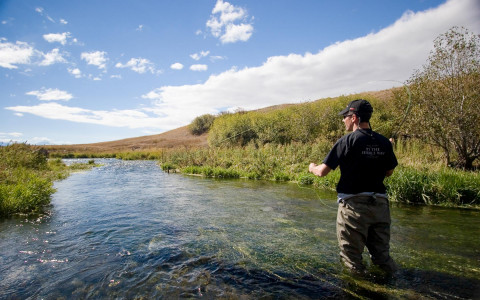 Man standing in the river fly fishing