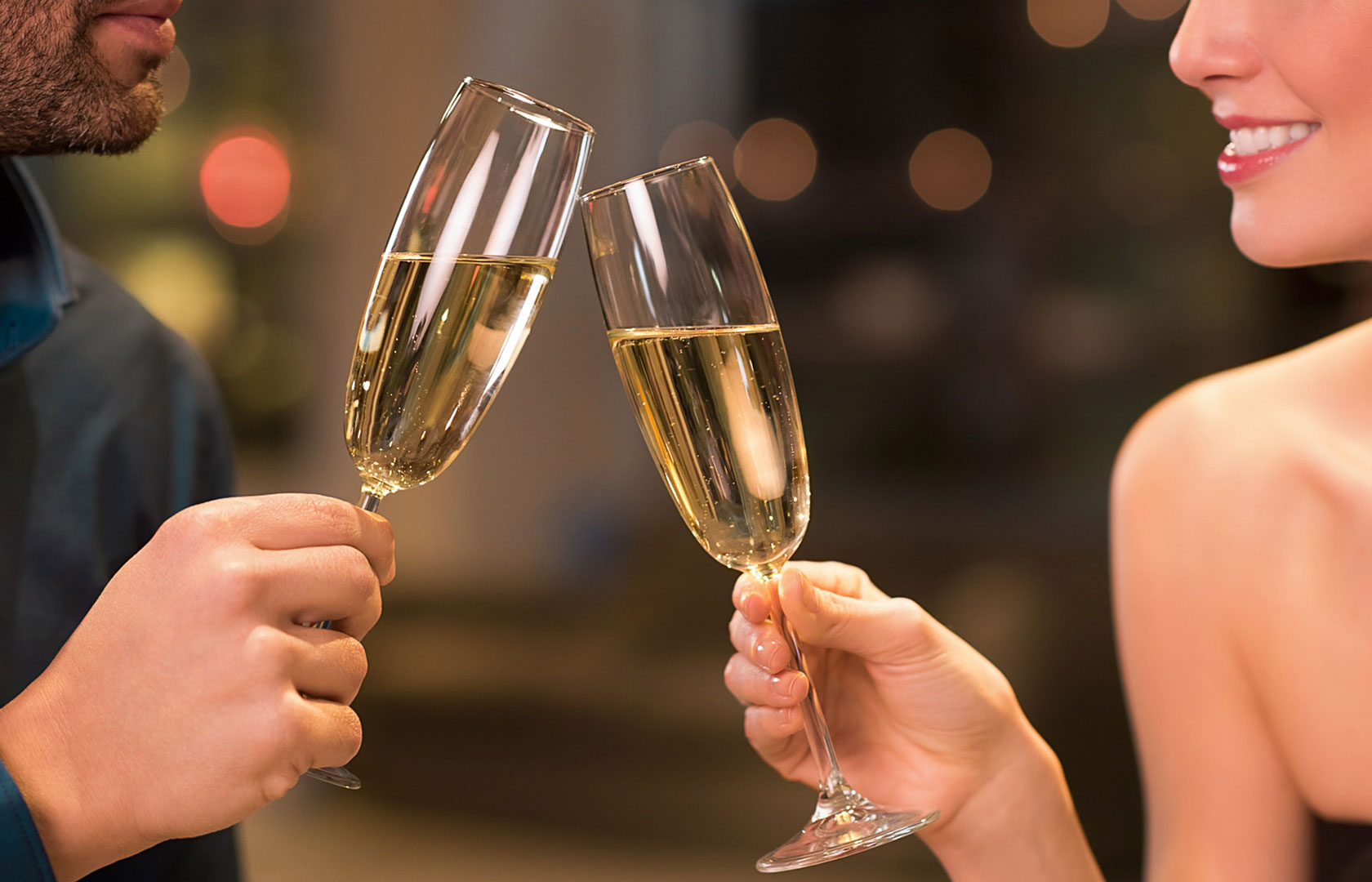 Couple clinking champagne glasses