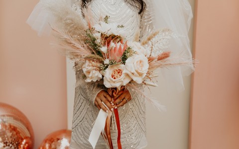 bride holding her flower bouquet